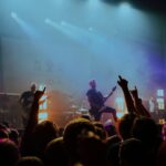 group of band on stage with LED lights